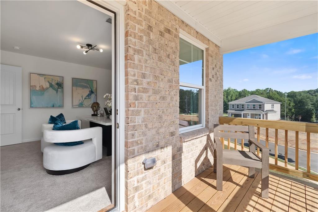 200 Chiswick Loop Stockbridge, GA 30281 - Photo 29 of 44 a living room with furniture and a large window