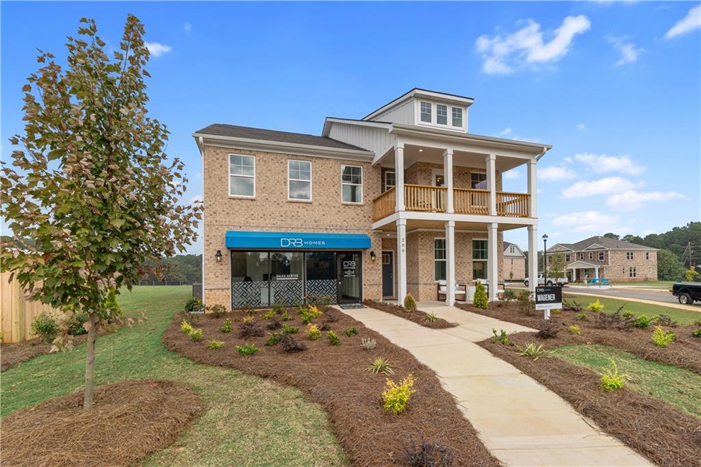 200 Chiswick Loop Stockbridge, GA 30281 - Photo 3 of 44 a front view of a house with a yard