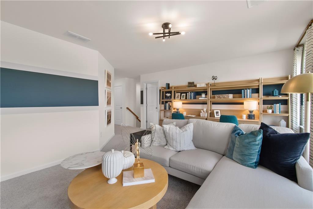200 Chiswick Loop Stockbridge, GA 30281 - Photo 32 of 44 a living room with furniture and a wooden floor