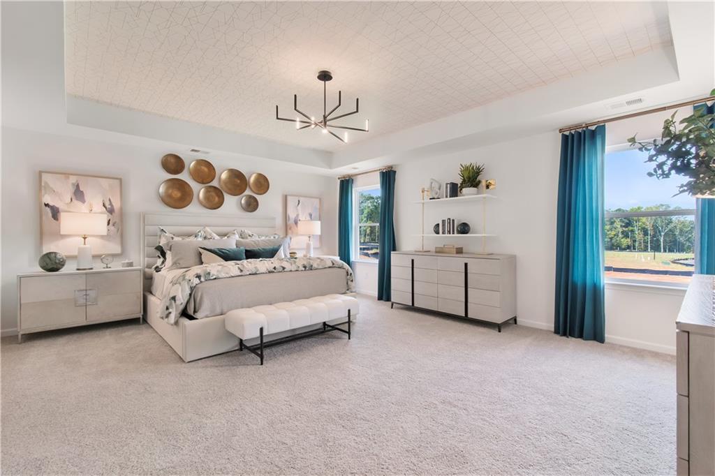 200 Chiswick Loop Stockbridge, GA 30281 - Photo 33 of 44 a bedroom with a bed couch and window