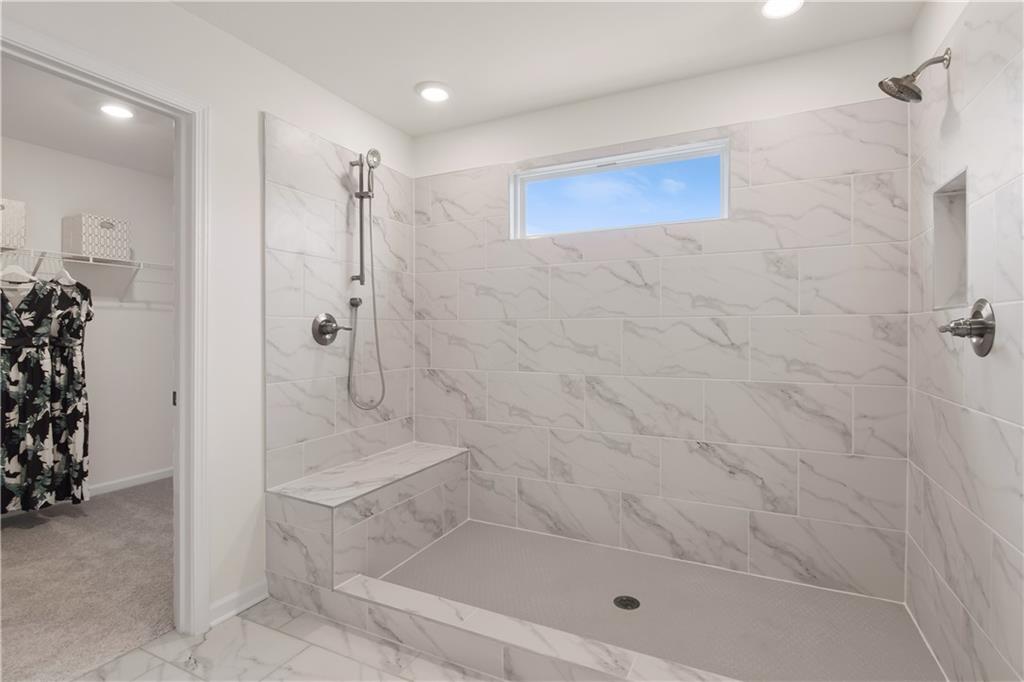 200 Chiswick Loop Stockbridge, GA 30281 - Photo 38 of 44 a bathroom with a shower and a sink