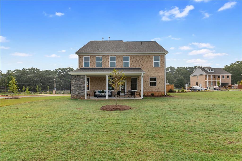 200 Chiswick Loop Stockbridge, GA 30281 - Photo 42 of 44 a view of a house with a yard porch and sitting area