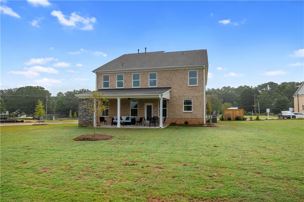 200 Chiswick Loop Stockbridge, GA 30281 - Photo 43 of 44 a view of a house with a yard