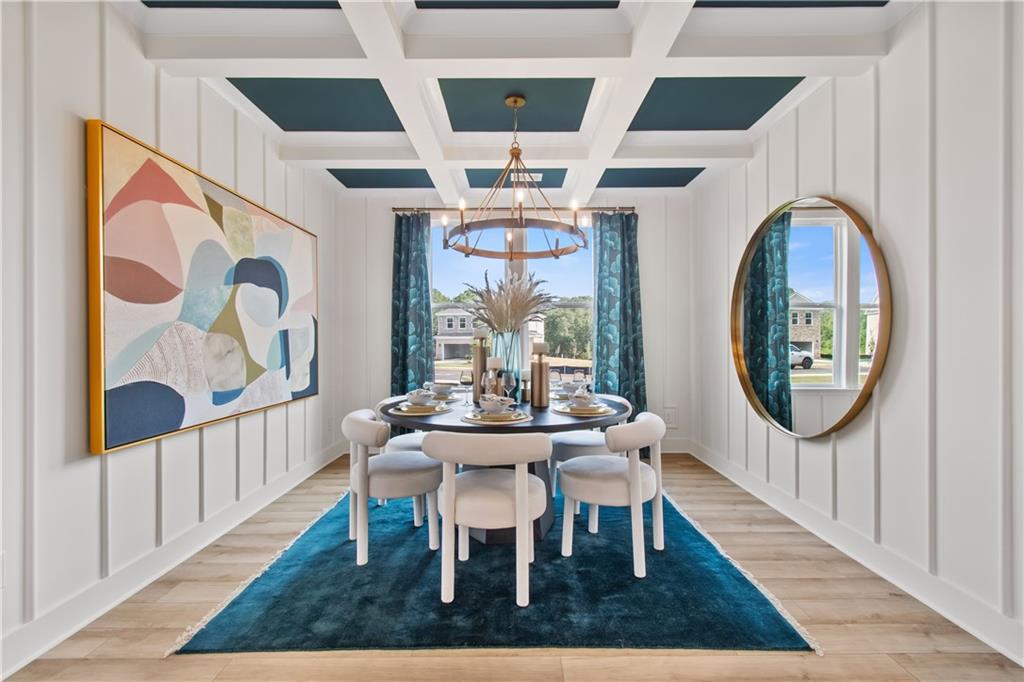 200 Chiswick Loop Stockbridge, GA 30281 - Photo 8 of 44 a view of a dining room with furniture wooden floor and a chandelier