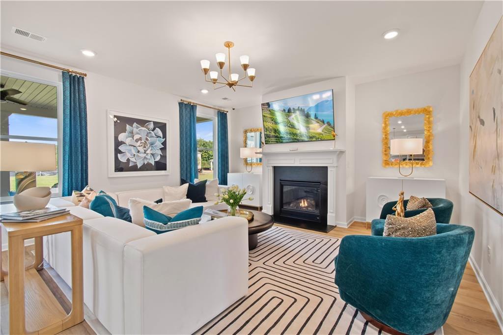 200 Chiswick Loop Stockbridge, GA 30281 - Photo 10 of 44 a living room with furniture and a fireplace