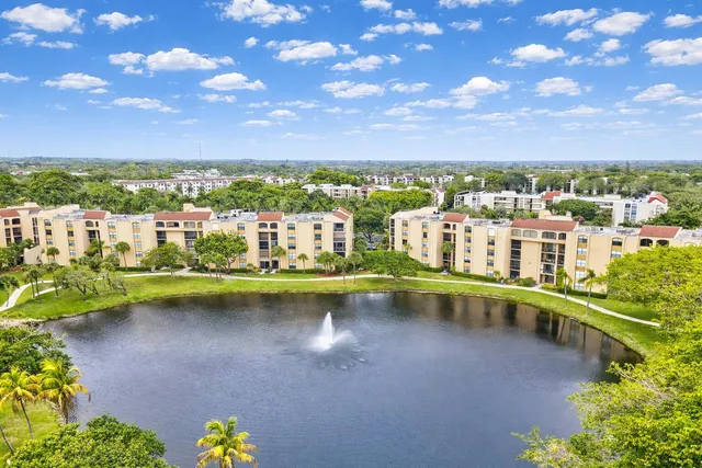 a large white kitchen with cabinets