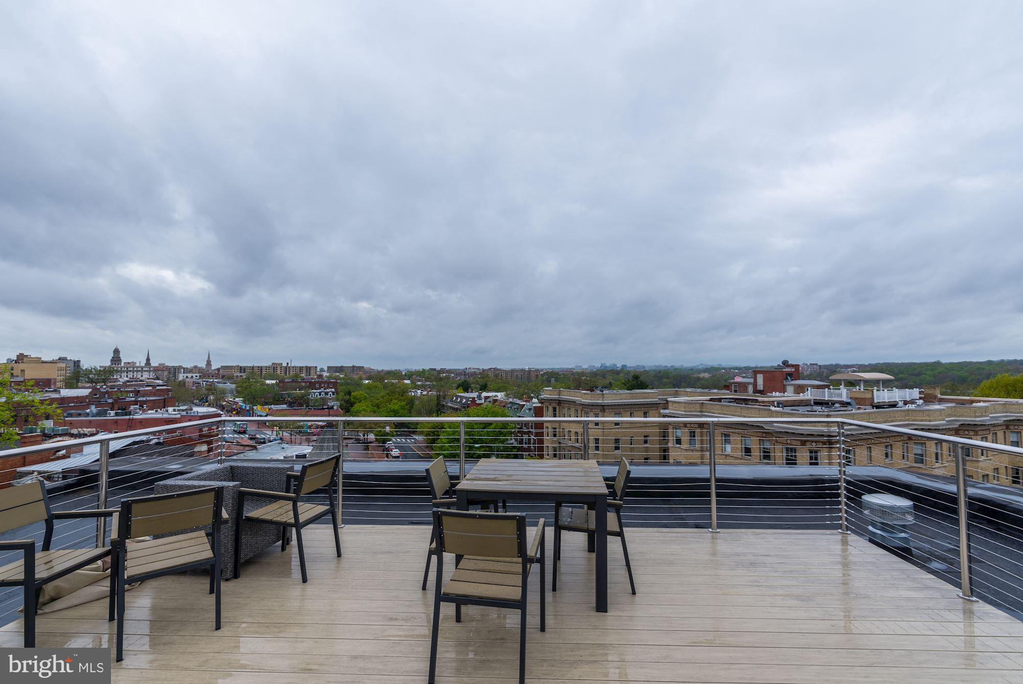1673 Park Road Northwest, Unit 505 Washington, DC 20010 - Photo 15 of 17 a view of a chairs and table on the terrace