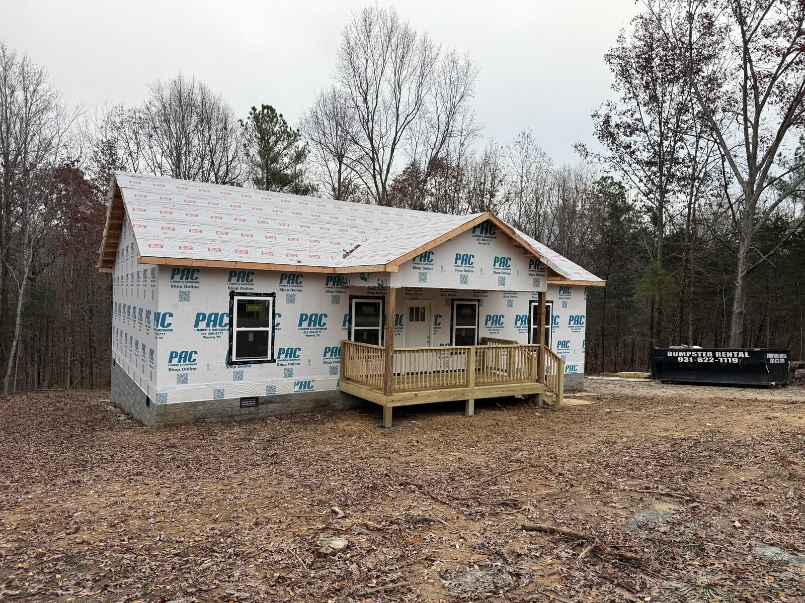690 Brazzle Road Waverly, TN 37185 - Photo 6 of 6 a view of a house with a yard and large trees