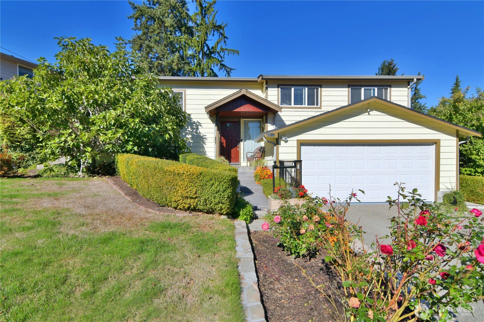 23116 80th Place West Edmonds, WA 98026 - Photo 1 of 34 a front view of a house with a yard