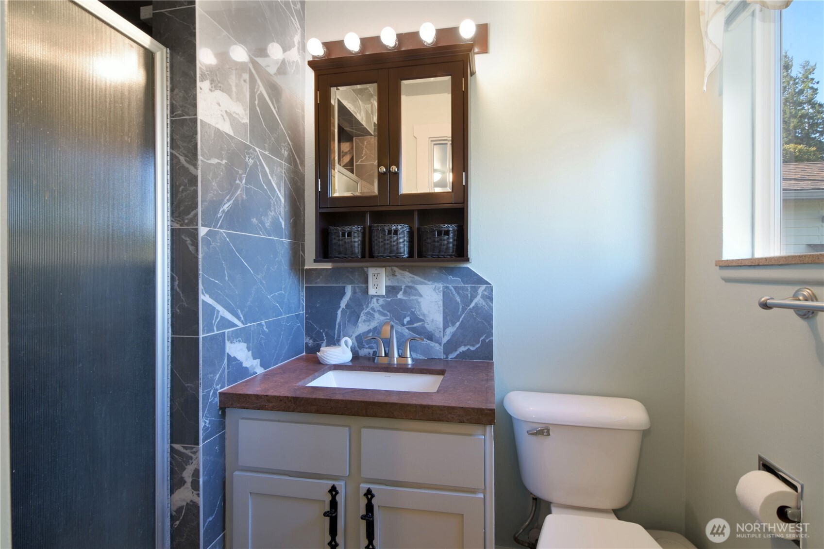 23116 80th Place West Edmonds, WA 98026 - Photo 15 of 34 a bathroom with a toilet a sink and mirror