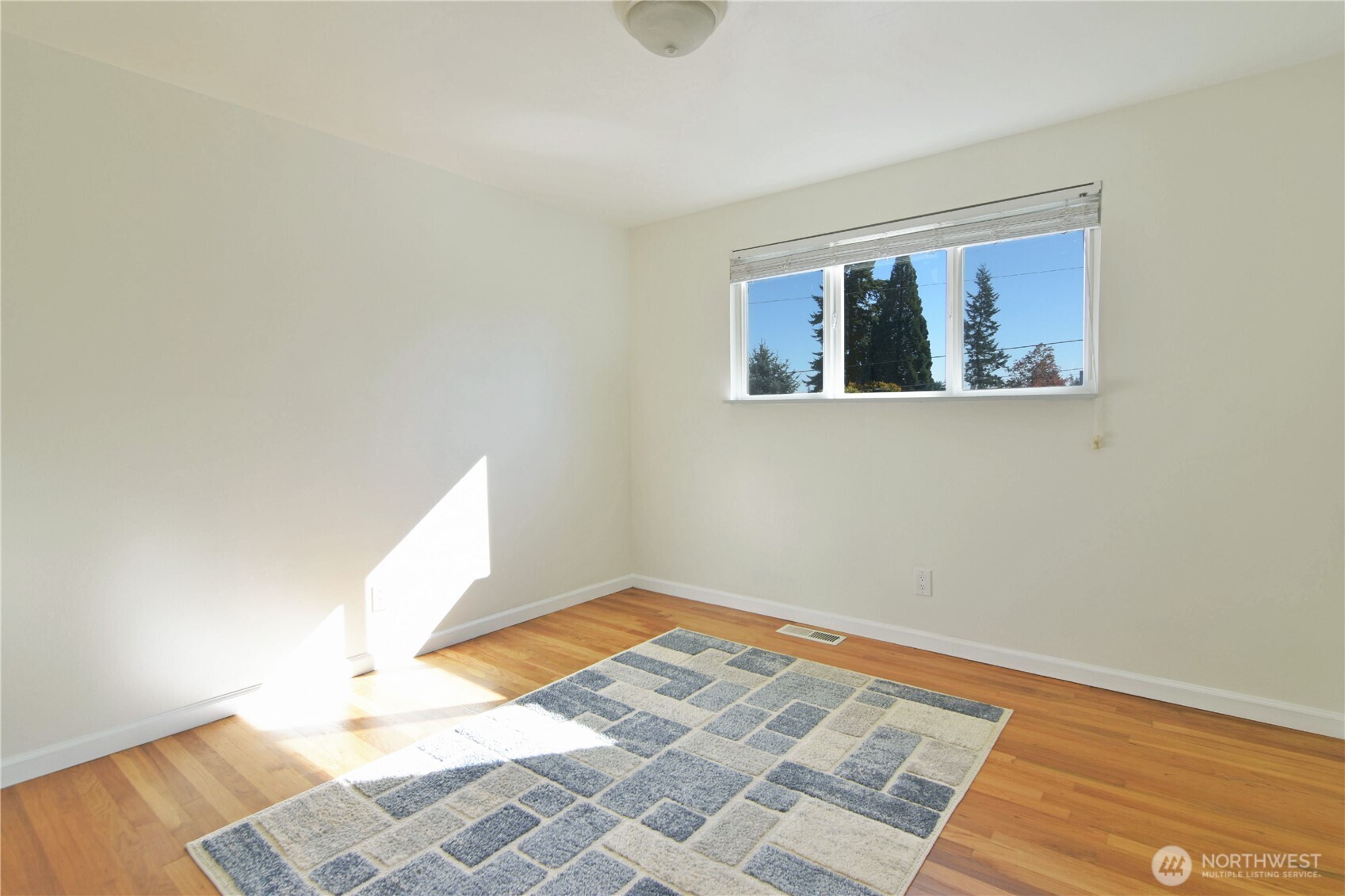 23116 80th Place West Edmonds, WA 98026 - Photo 16 of 34 a view of a room with wooden floor and cabinet