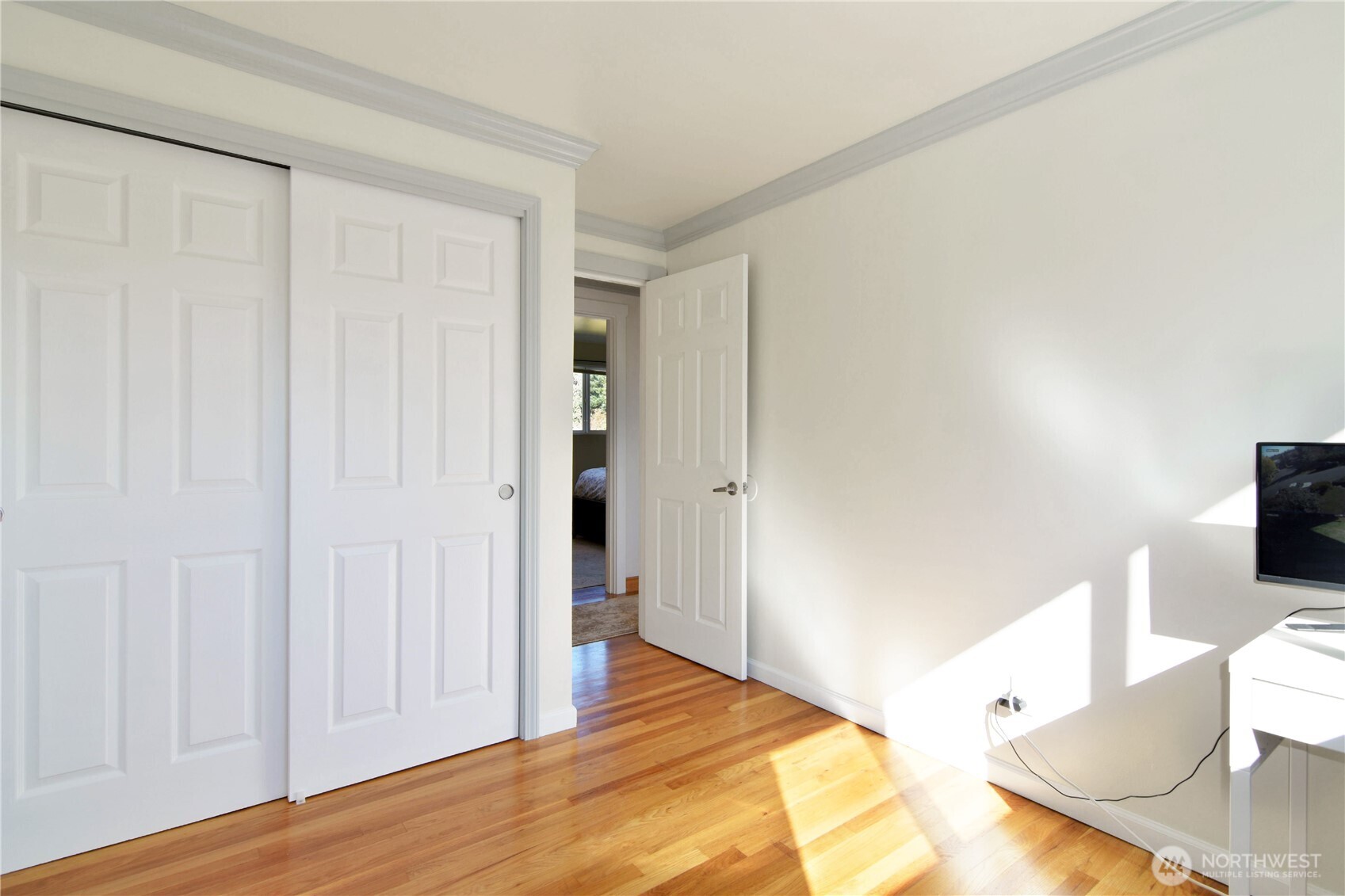 23116 80th Place West Edmonds, WA 98026 - Photo 19 of 34 a bedroom with a bed and a flat screen tv