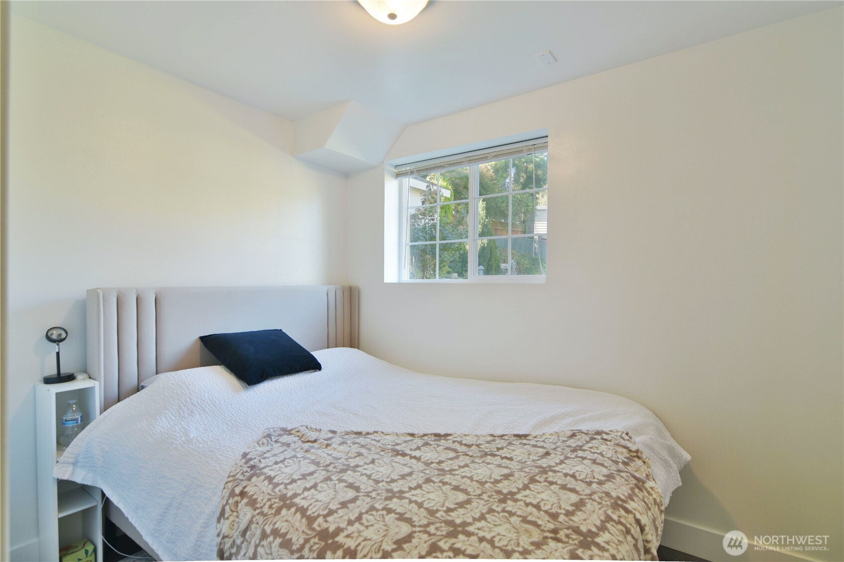 23116 80th Place West Edmonds, WA 98026 - Photo 28 of 34 a bedroom with a bed and a window