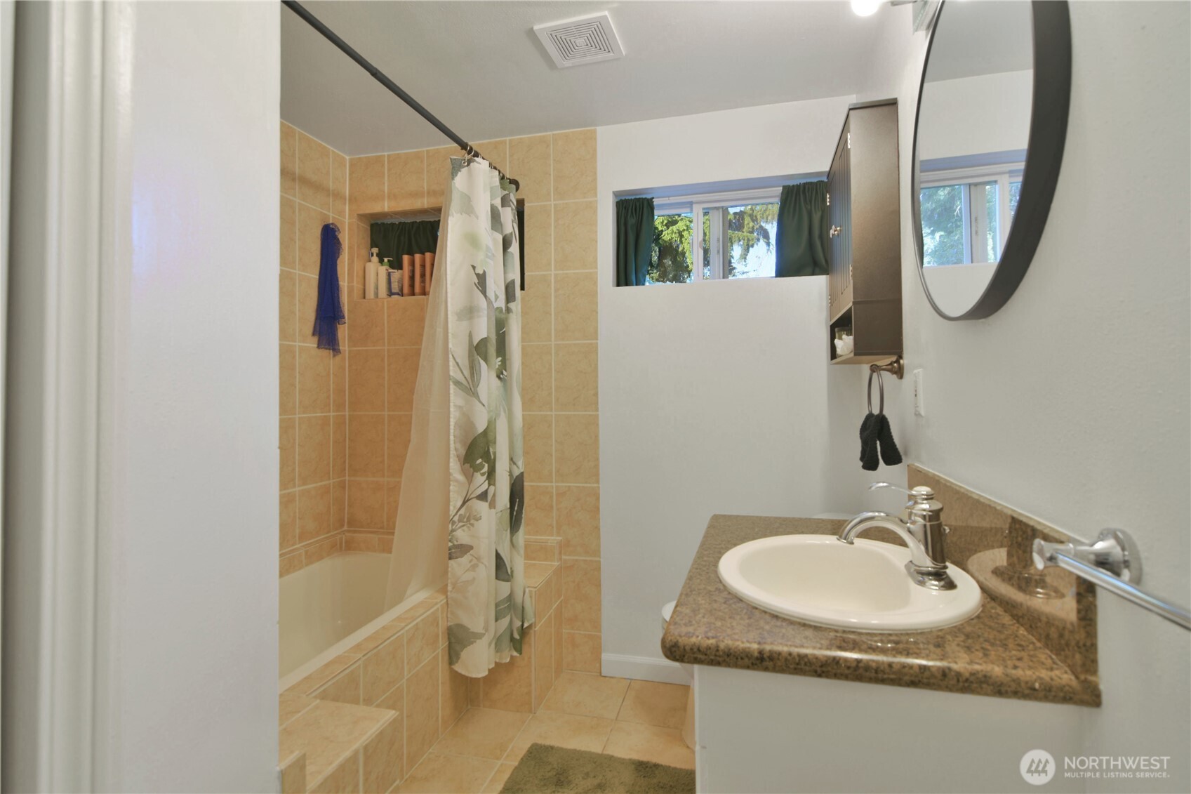 23116 80th Place West Edmonds, WA 98026 - Photo 30 of 34 a bathroom with a sink a toilet and a mirror