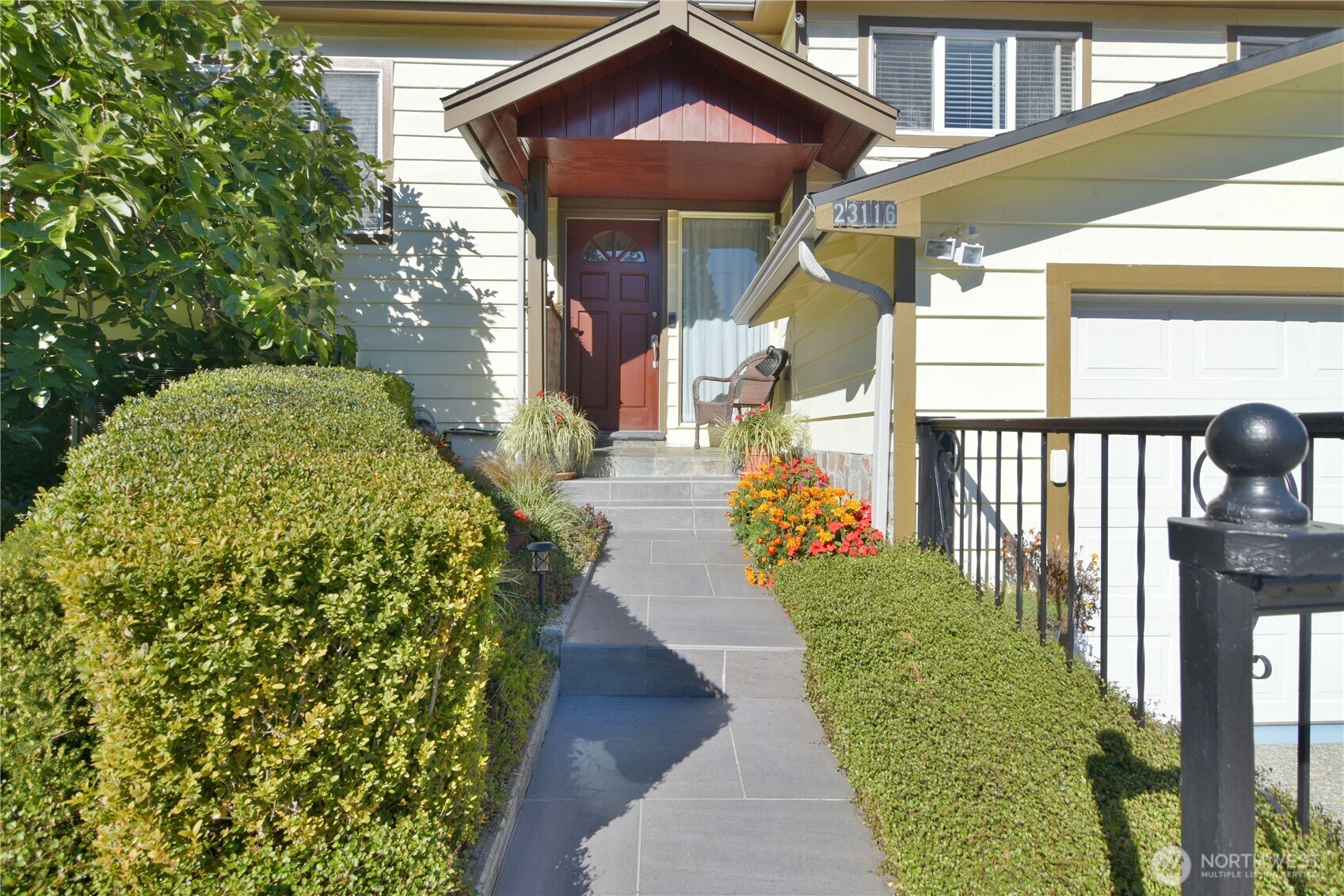23116 80th Place West Edmonds, WA 98026 - Photo 3 of 34 a view of a pathway of a house with a garden