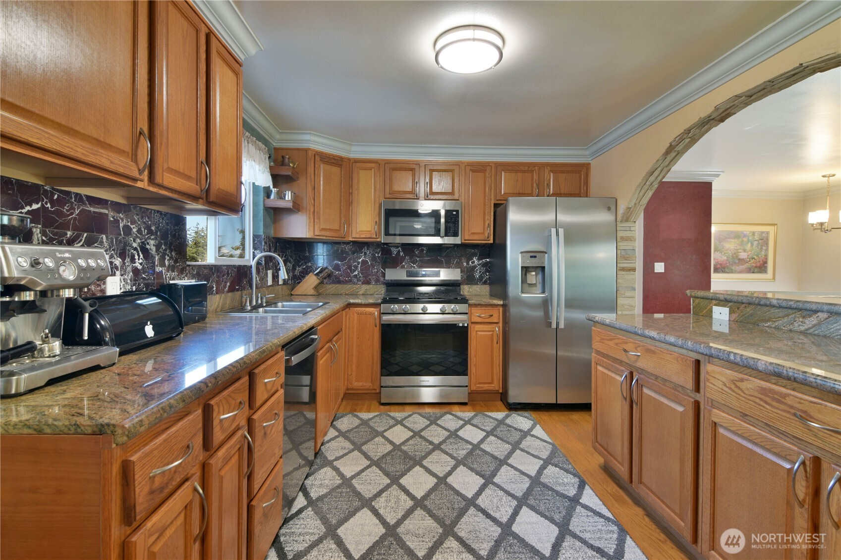 23116 80th Place West Edmonds, WA 98026 - Photo 9 of 34 a kitchen with stainless steel appliances granite countertop a stove a sink and a refrigerator