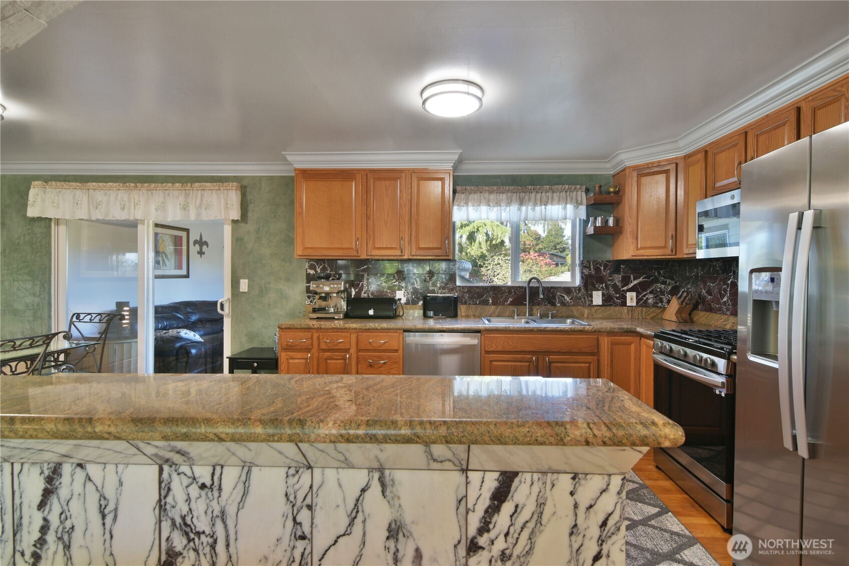 23116 80th Place West Edmonds, WA 98026 - Photo 10 of 34 a kitchen with stainless steel appliances granite countertop a stove a sink and a refrigerator