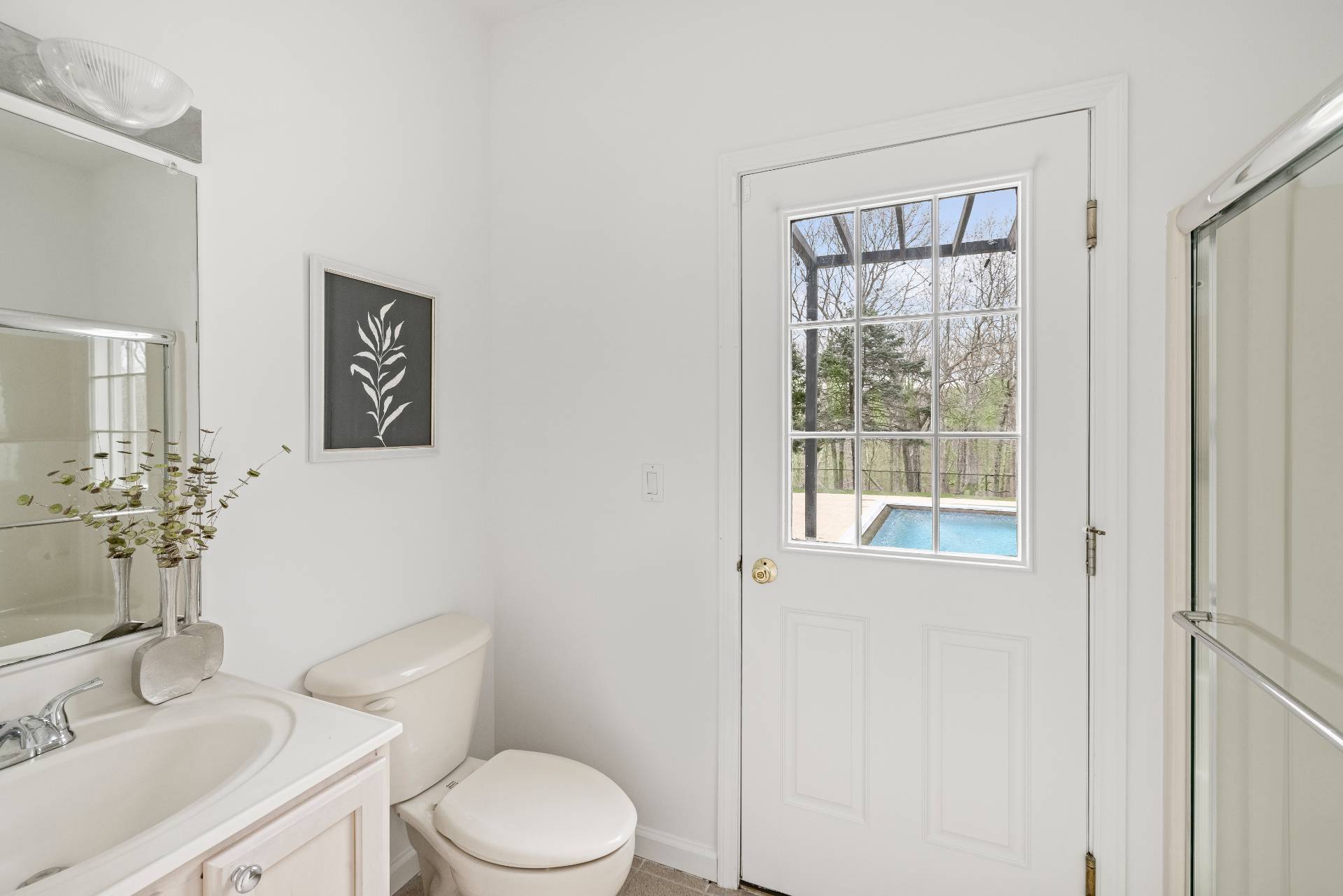 28 Quail Run Hampton Bays, NY 11946 - Photo 14 of 22 a white toilet sitting next to a bathroom sink