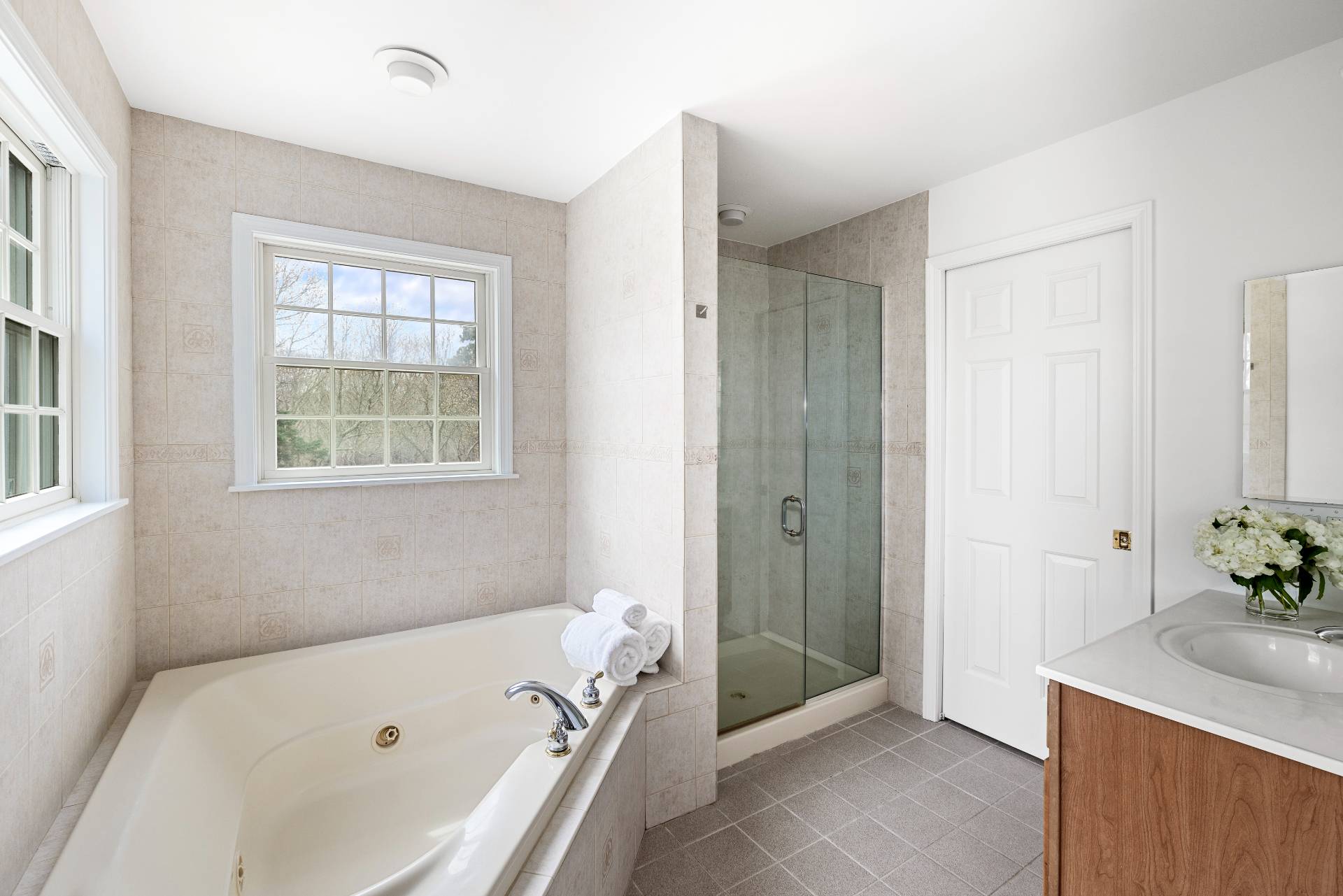 28 Quail Run Hampton Bays, NY 11946 - Photo 18 of 22 a bathroom with a tub and a sink