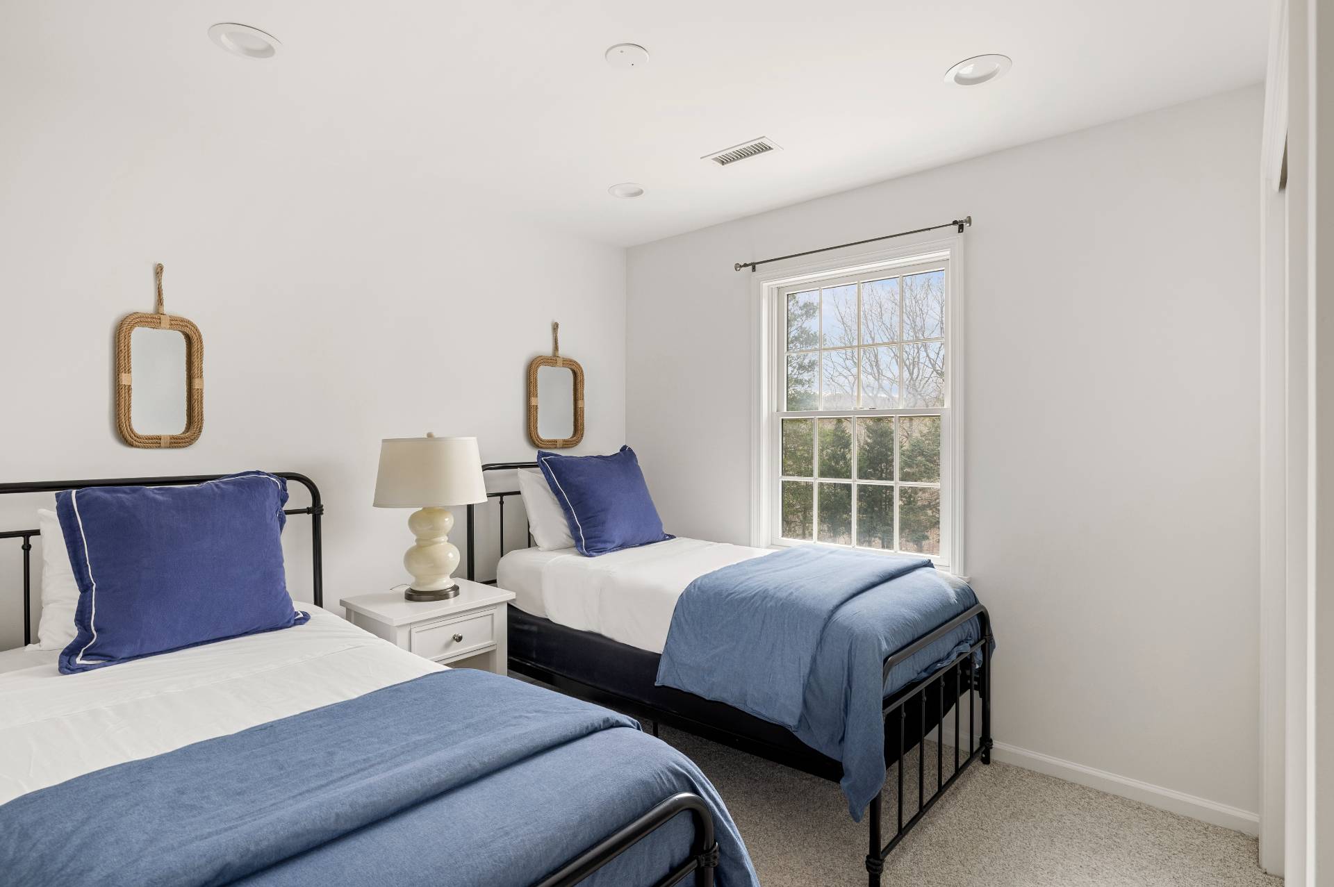 28 Quail Run Hampton Bays, NY 11946 - Photo 22 of 22 a bedroom with bed and window