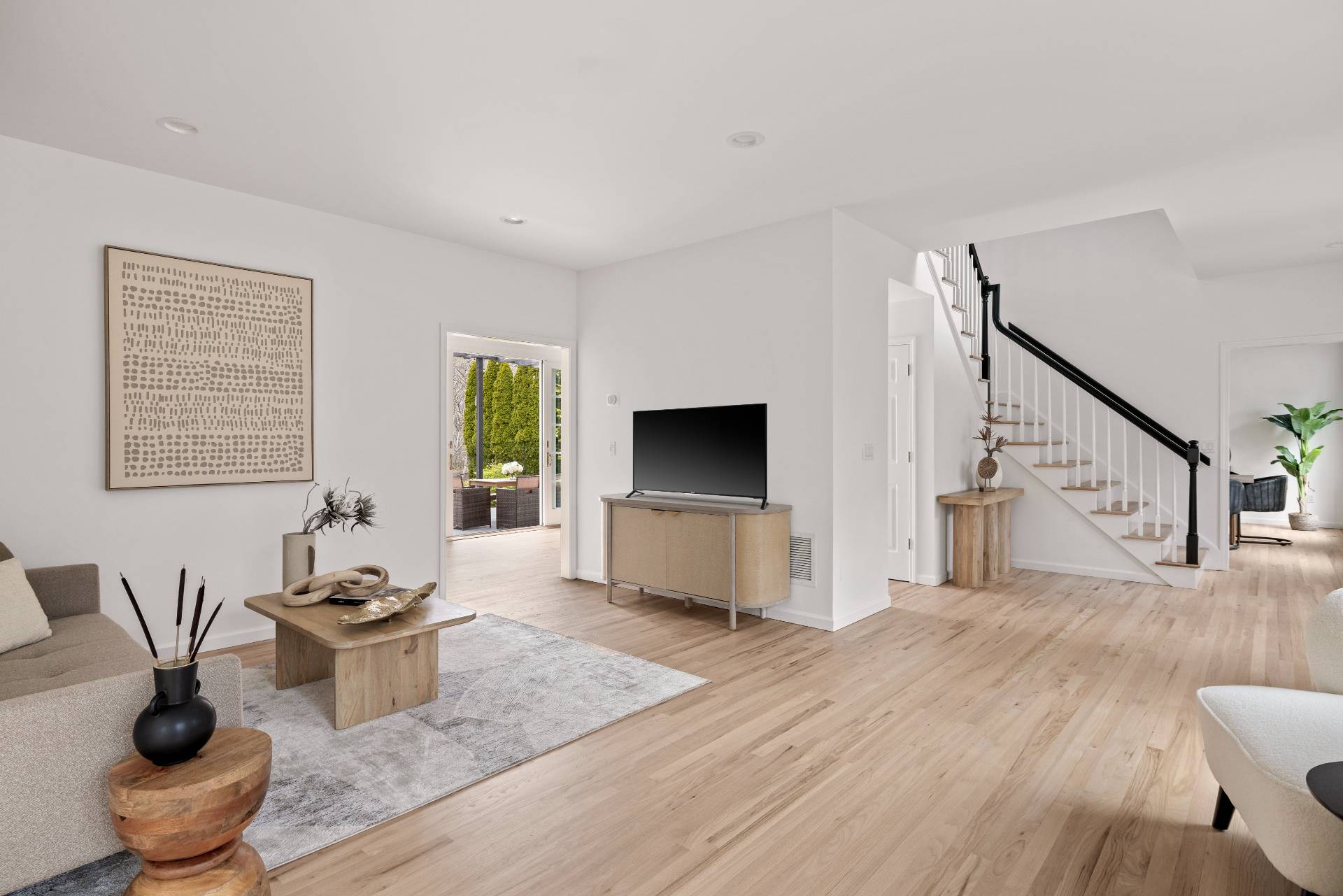 28 Quail Run Hampton Bays, NY 11946 - Photo 7 of 22 a living room with furniture potted plant and a window