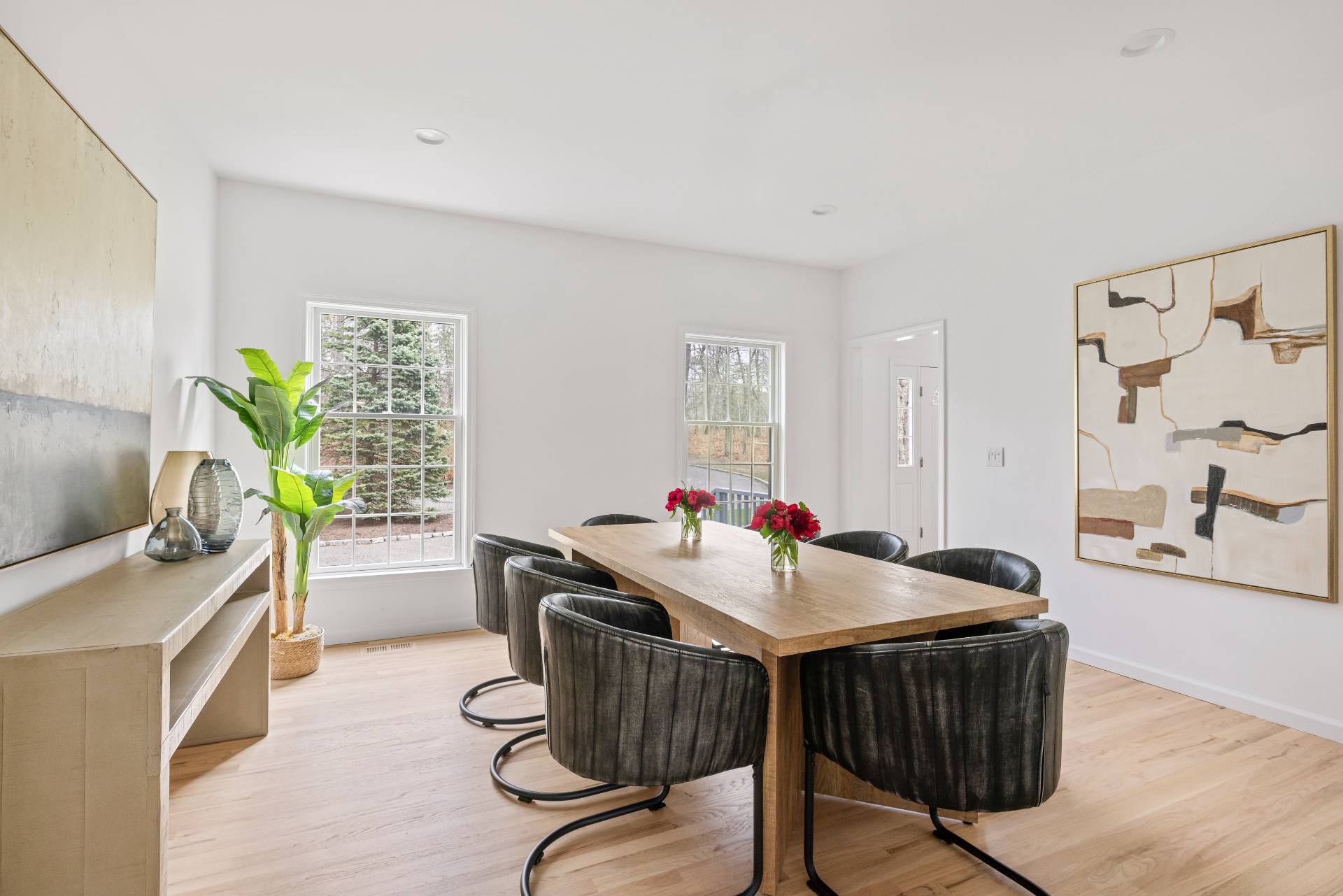 28 Quail Run Hampton Bays, NY 11946 - Photo 9 of 22 a view of a dining room with furniture window and wooden floor