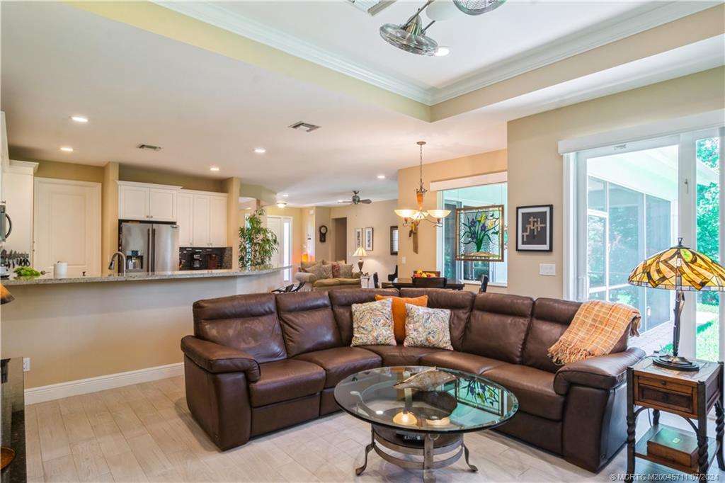 299 Southwest Cocoloba Way Stuart, FL 34997 - Photo 17 of 35 Coffered ceiling and crown molding