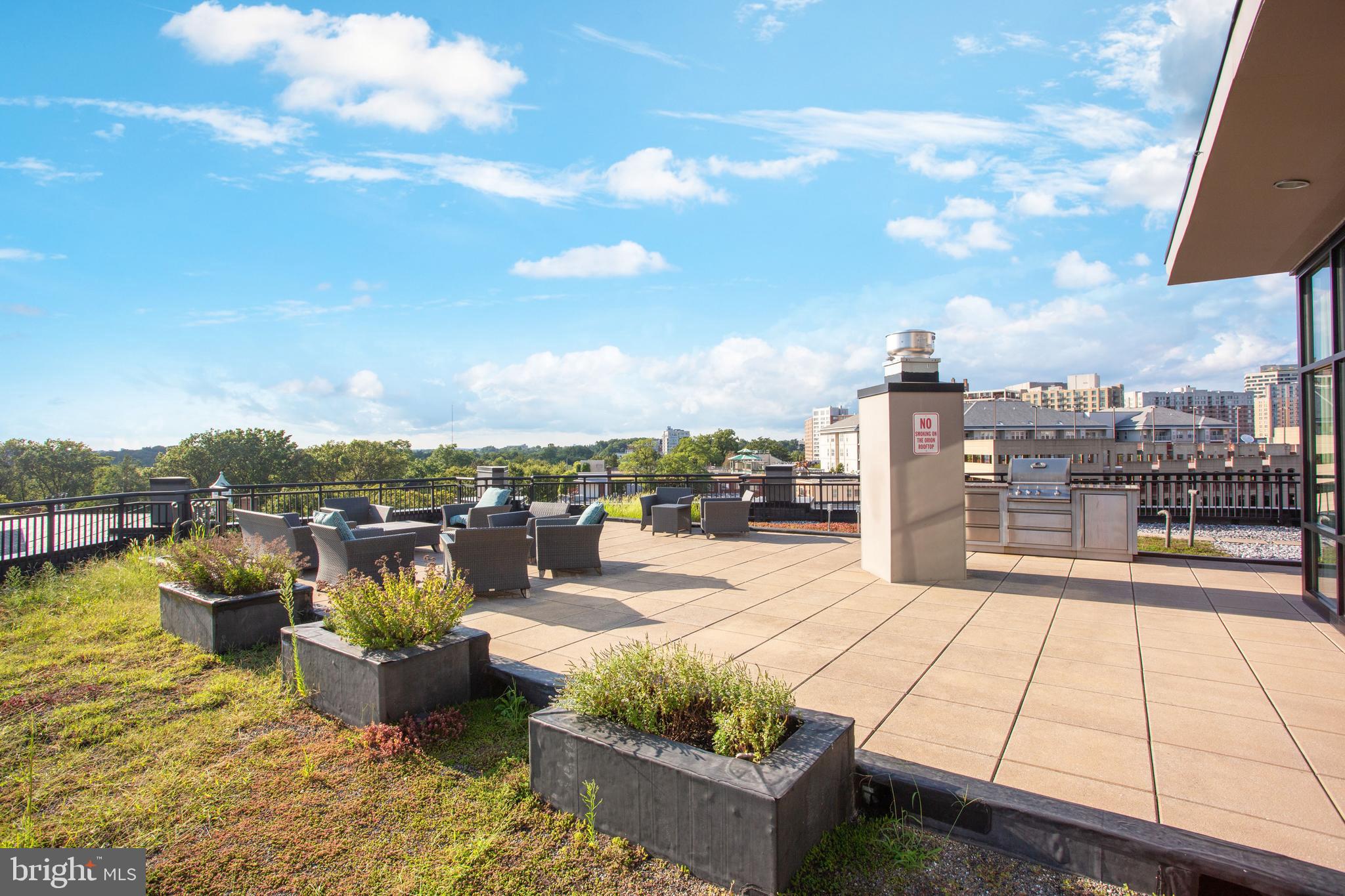 8005 13th Street, Unit 305 Silver Spring, MD 20910 - Photo 39 of 40 a view of a terrace with seating space
