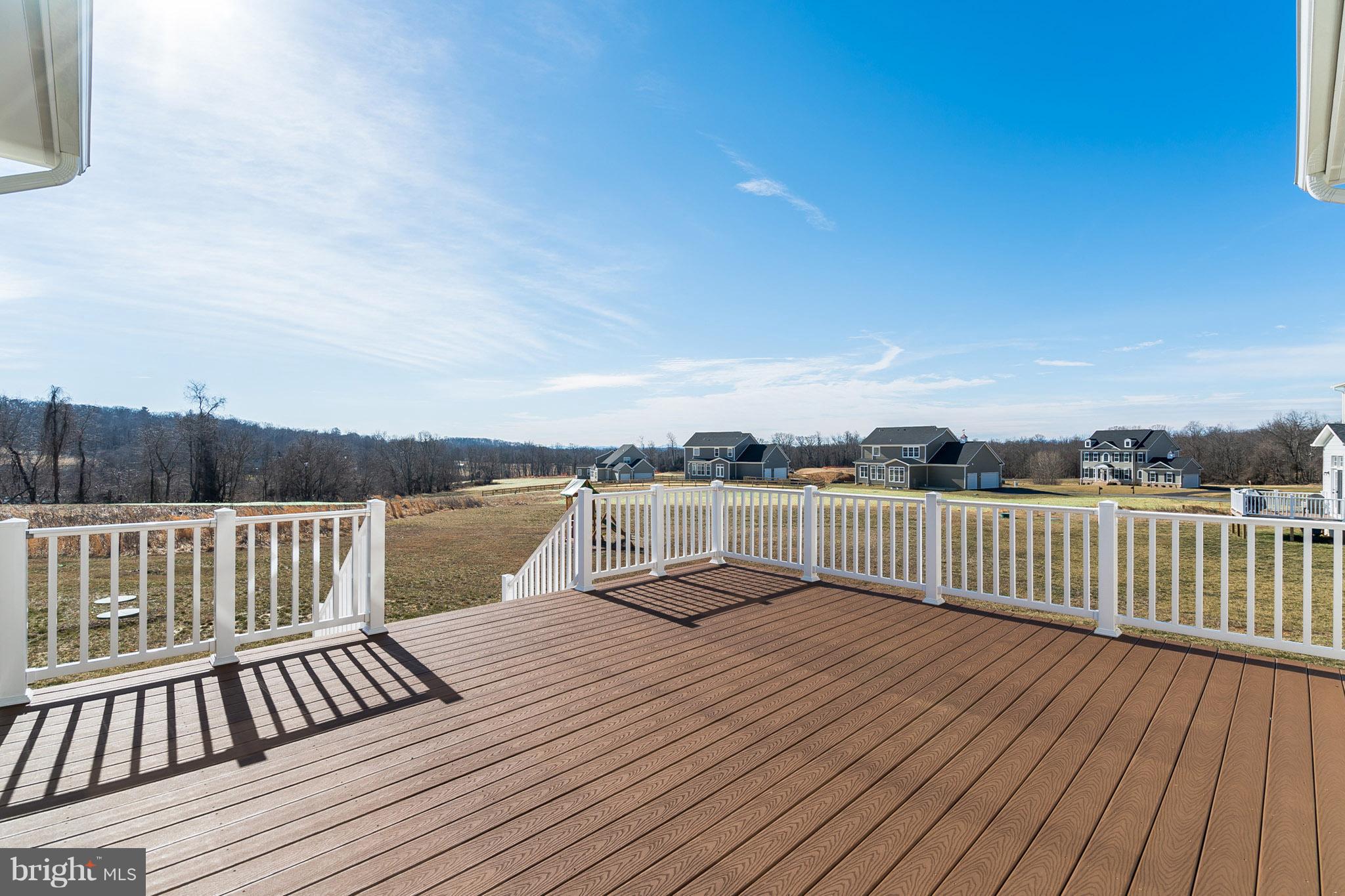 18285 Wild Raspberry Drive Purcellville, VA 20132 - Photo 12 of 12 Expansive Trex deck, backs to open land