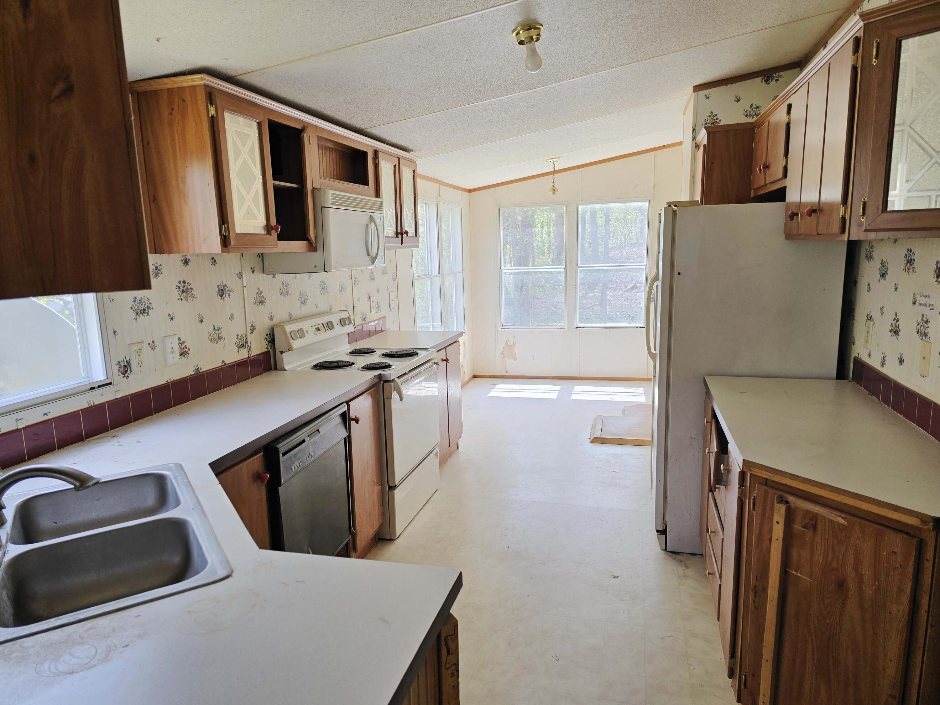 1188 Easter Lane Blue Ridge, VA 24064 - Photo 31 of 33 a kitchen with stainless steel appliances a stove a sink and a refrigerator