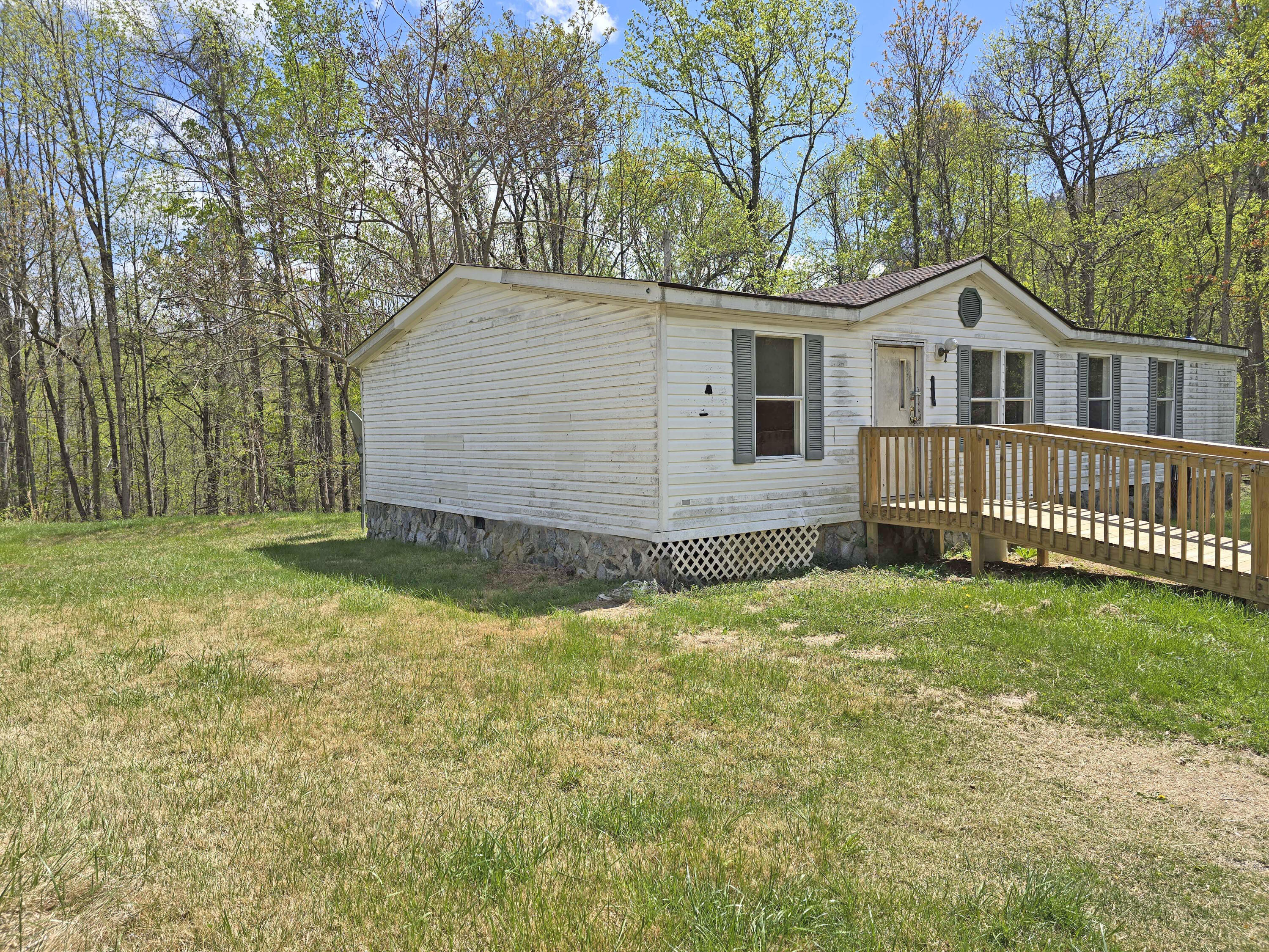 1188 Easter Lane Blue Ridge, VA 24064 - Photo 5 of 33 a house with trees in the background