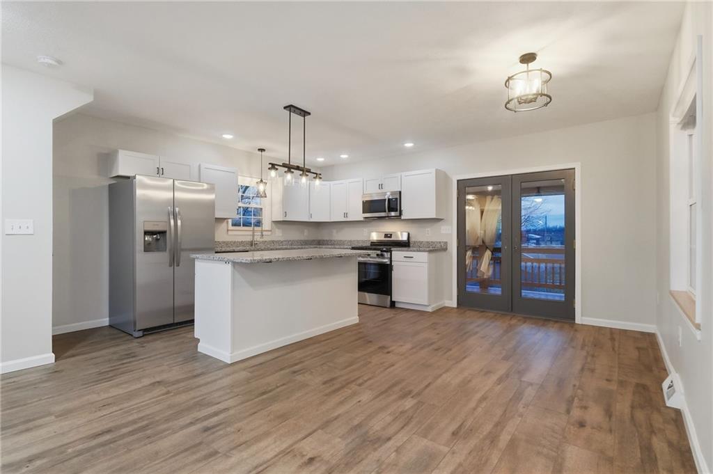 612 Virginia Avenue Rochester, PA 15074 - Photo 11 of 36 a kitchen with stainless steel appliances granite countertop a refrigerator a stove top oven a sink and dishwasher