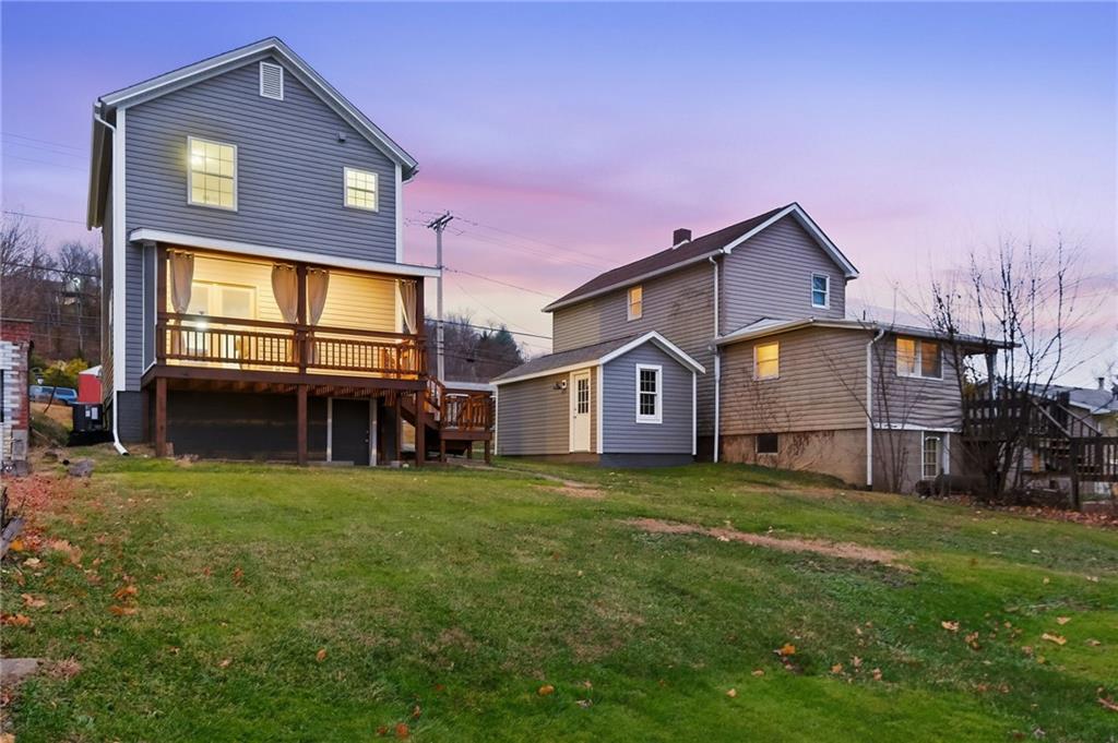 612 Virginia Avenue Rochester, PA 15074 - Photo 35 of 36 a view of a house with a big yard and a large tree