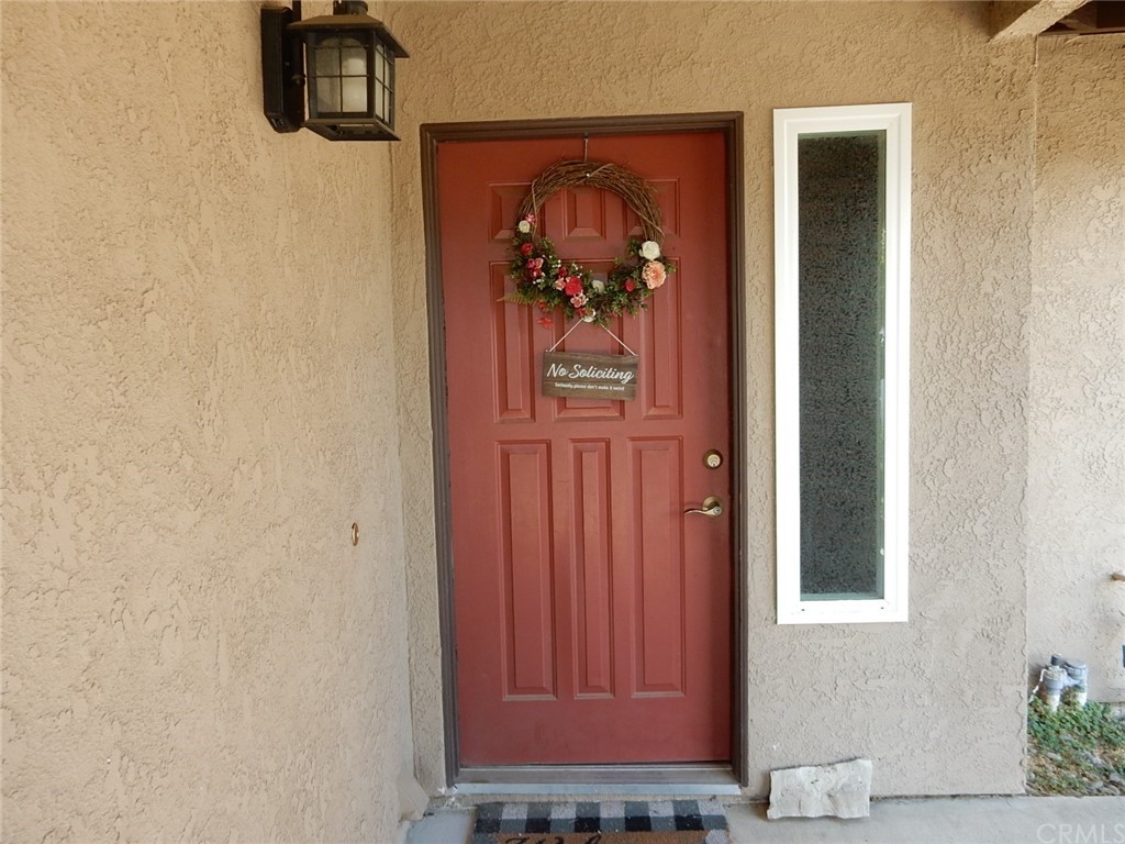 175 North Torn Ranch Road Lake Elsinore, CA 92530 - Photo 2 of 31 Front door leading to the living room.