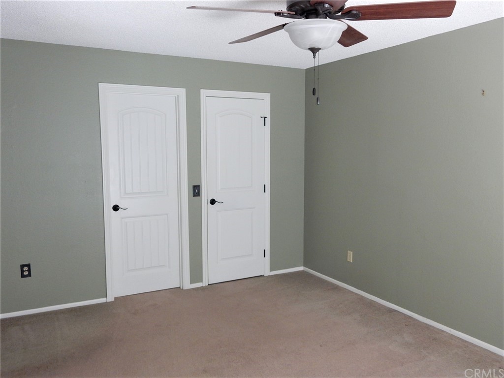 175 North Torn Ranch Road Lake Elsinore, CA 92530 - Photo 21 of 31 Door on the left is the master bath. Door on the right is the walk in closet.