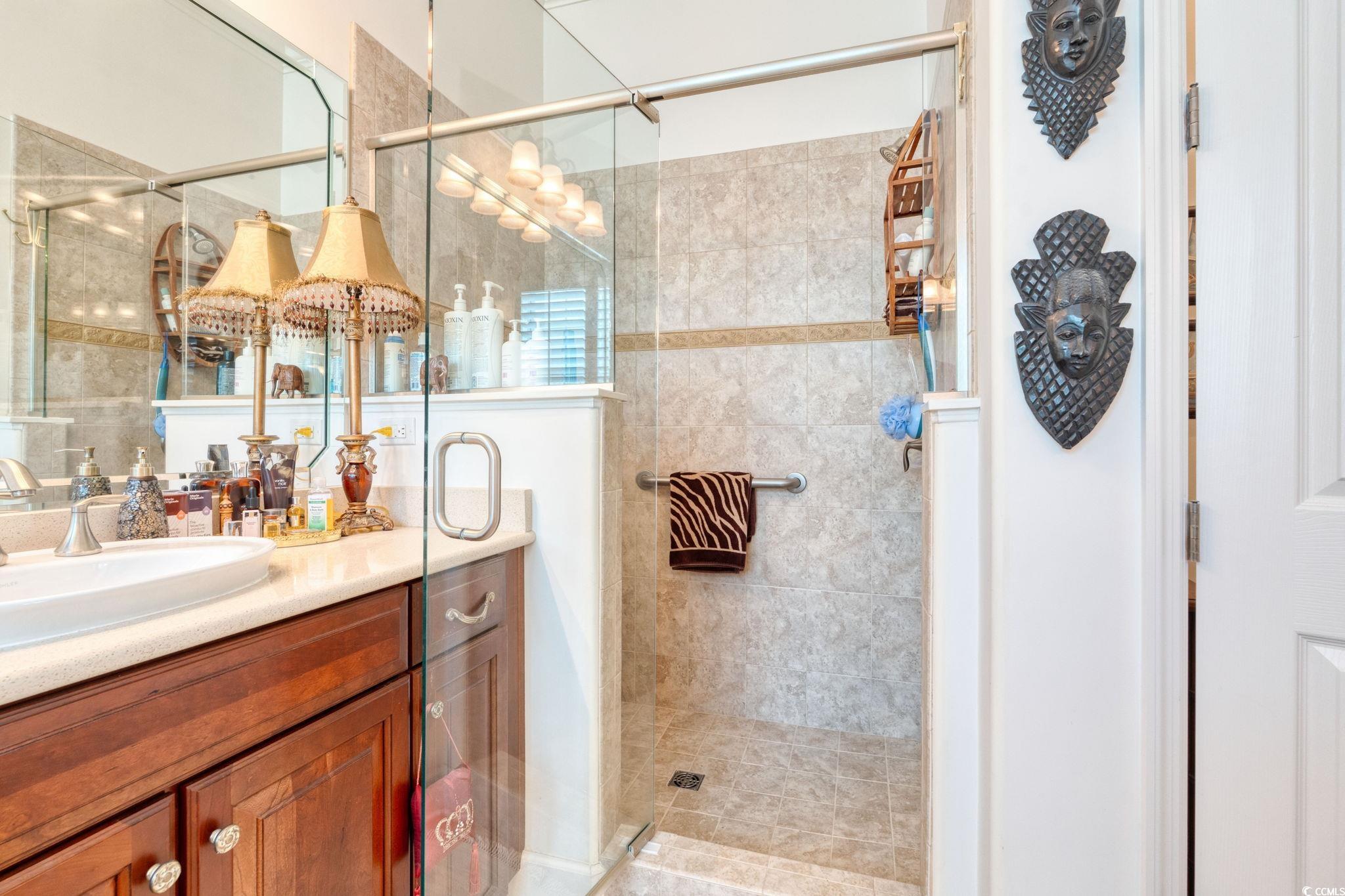492 Grand Cypress Way Murrells Inlet, SC 29576 - Photo 22 of 40 Bathroom with vanity and a shower stall