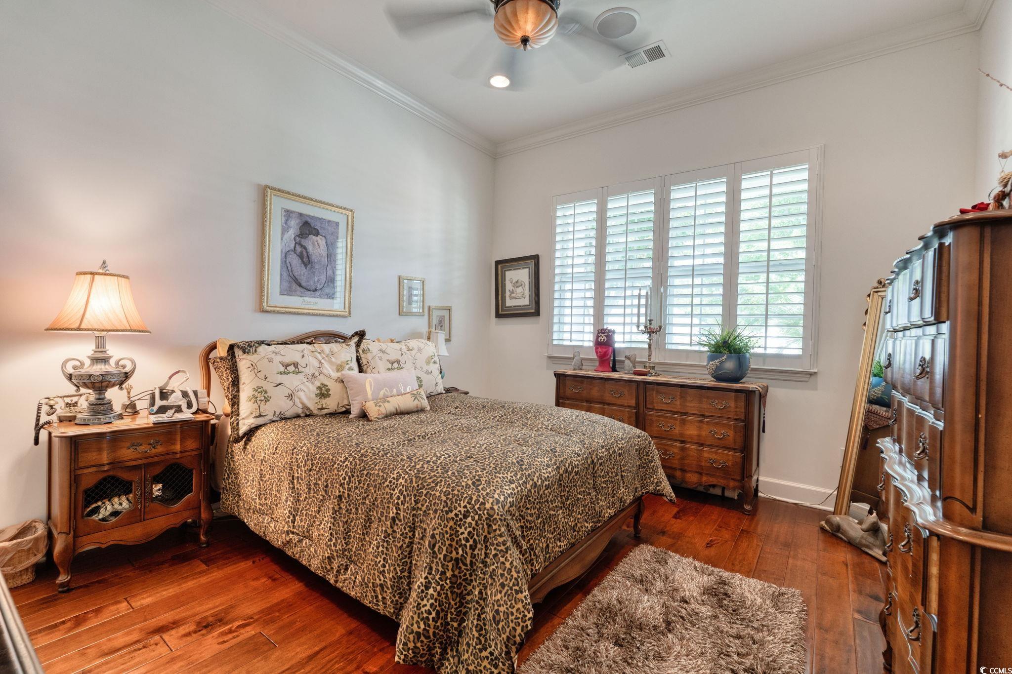 492 Grand Cypress Way Murrells Inlet, SC 29576 - Photo 25 of 40 Bedroom with dark wood-type flooring, crown molding, a ceiling fan, and recessed lighting