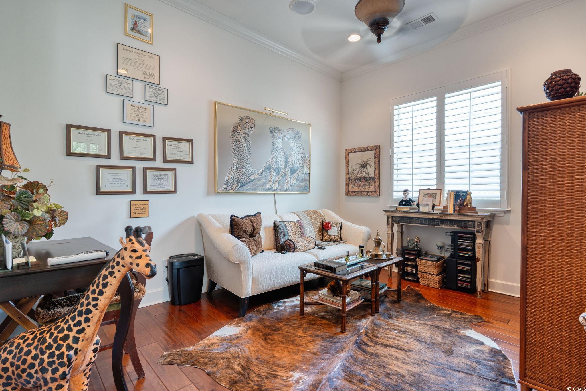 492 Grand Cypress Way Murrells Inlet, SC 29576 - Photo 26 of 40 Living room featuring hardwood / wood-style flooring, a ceiling fan, and crown molding