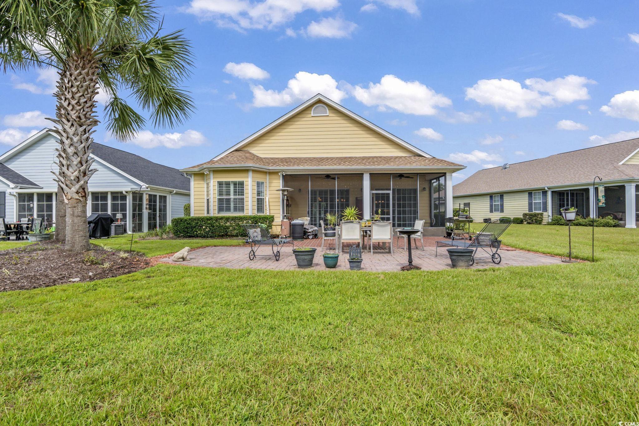 492 Grand Cypress Way Murrells Inlet, SC 29576 - Photo 31 of 40 Back of property featuring a patio, ceiling fan, a yard, and a sunroom