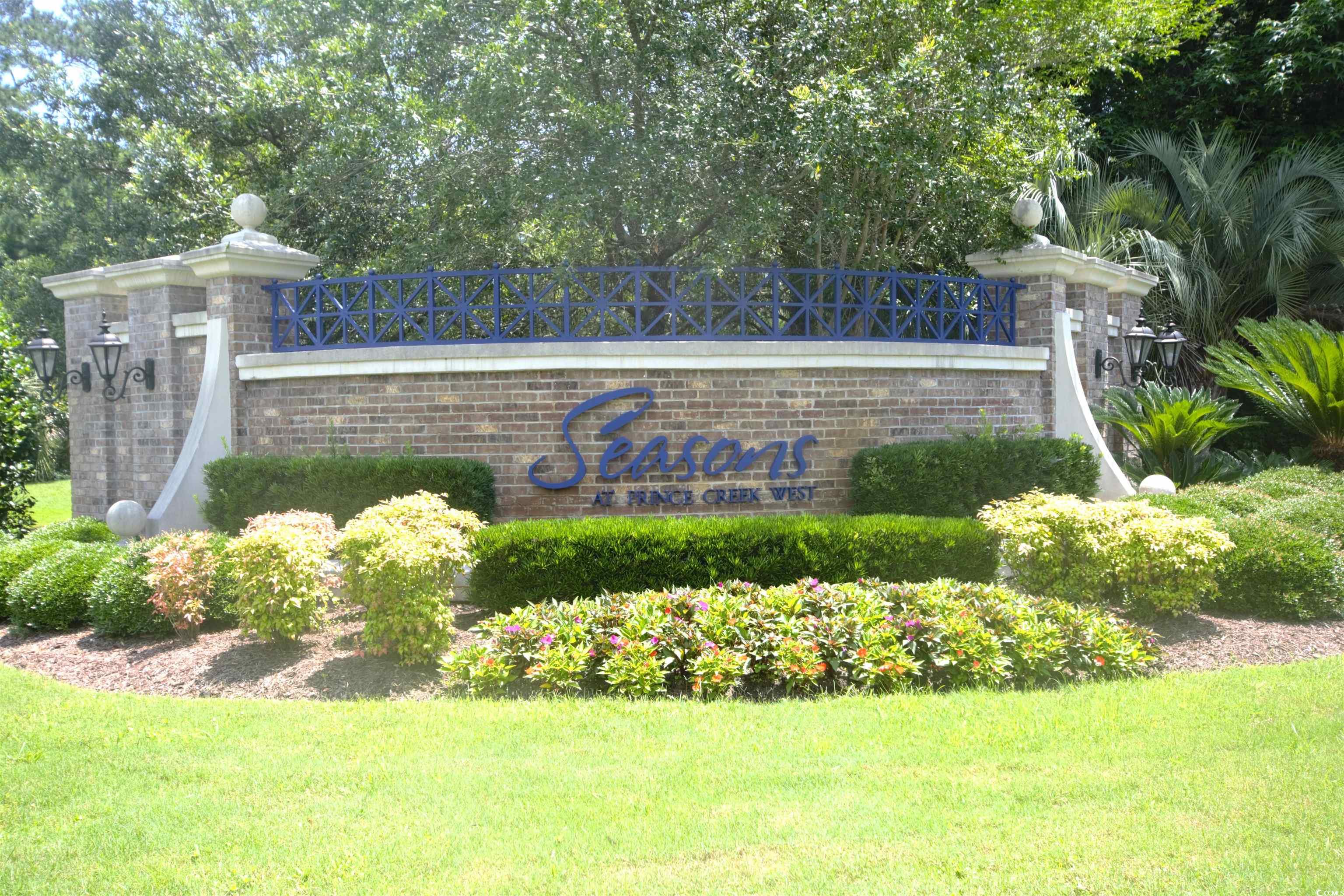 492 Grand Cypress Way Murrells Inlet, SC 29576 - Photo 33 of 40 Community / neighborhood sign with a lawn