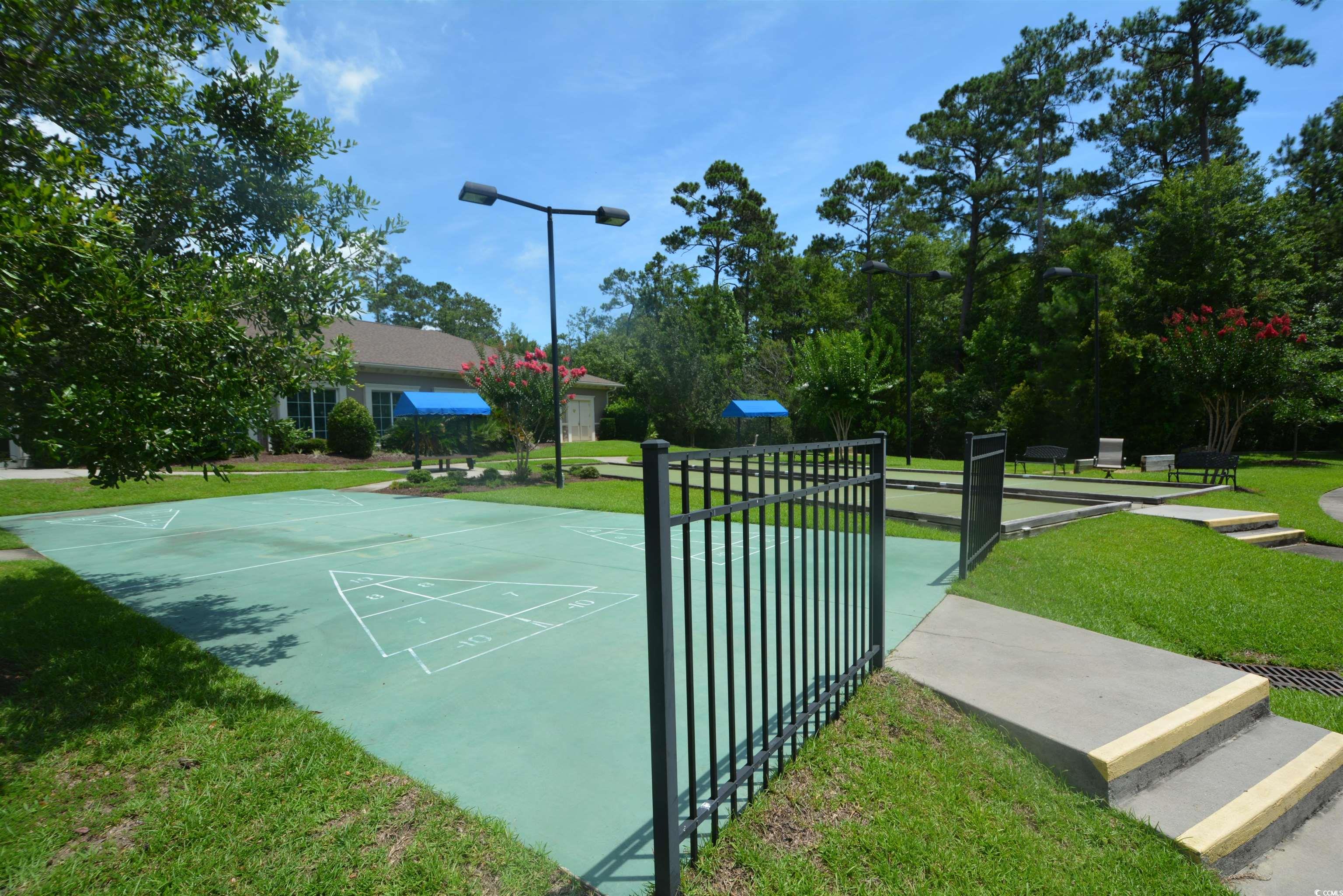 492 Grand Cypress Way Murrells Inlet, SC 29576 - Photo 39 of 40 View of property's community with shuffleboard and a yard