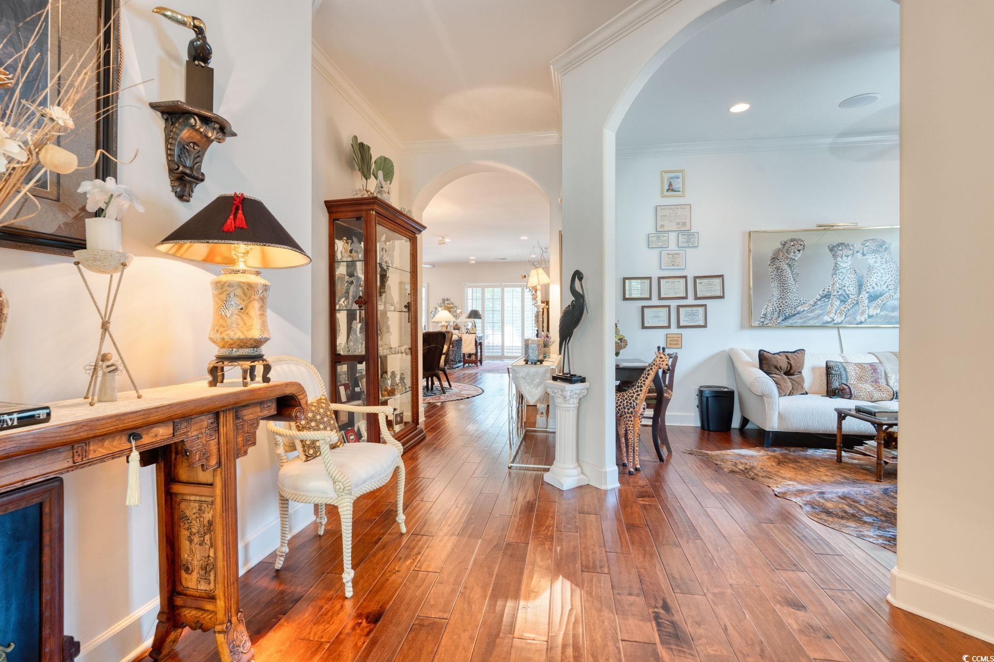 492 Grand Cypress Way Murrells Inlet, SC 29576 - Photo 4 of 40 Hall featuring arched walkways, wood-type flooring, ornamental molding, and recessed lighting
