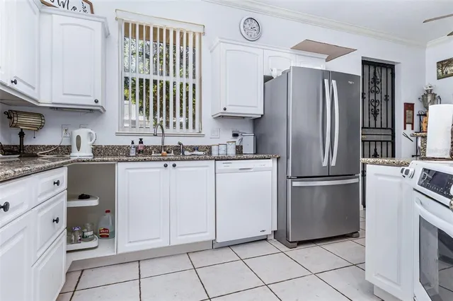 a kitchen with appliances cabinets and a sink