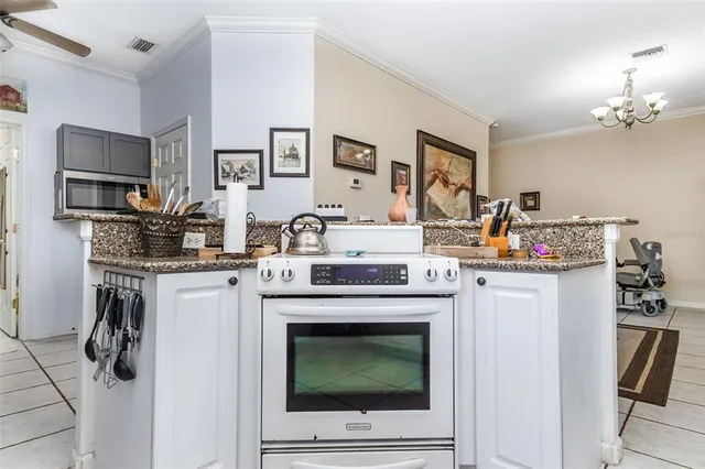 a kitchen with a stove and a refrigerator