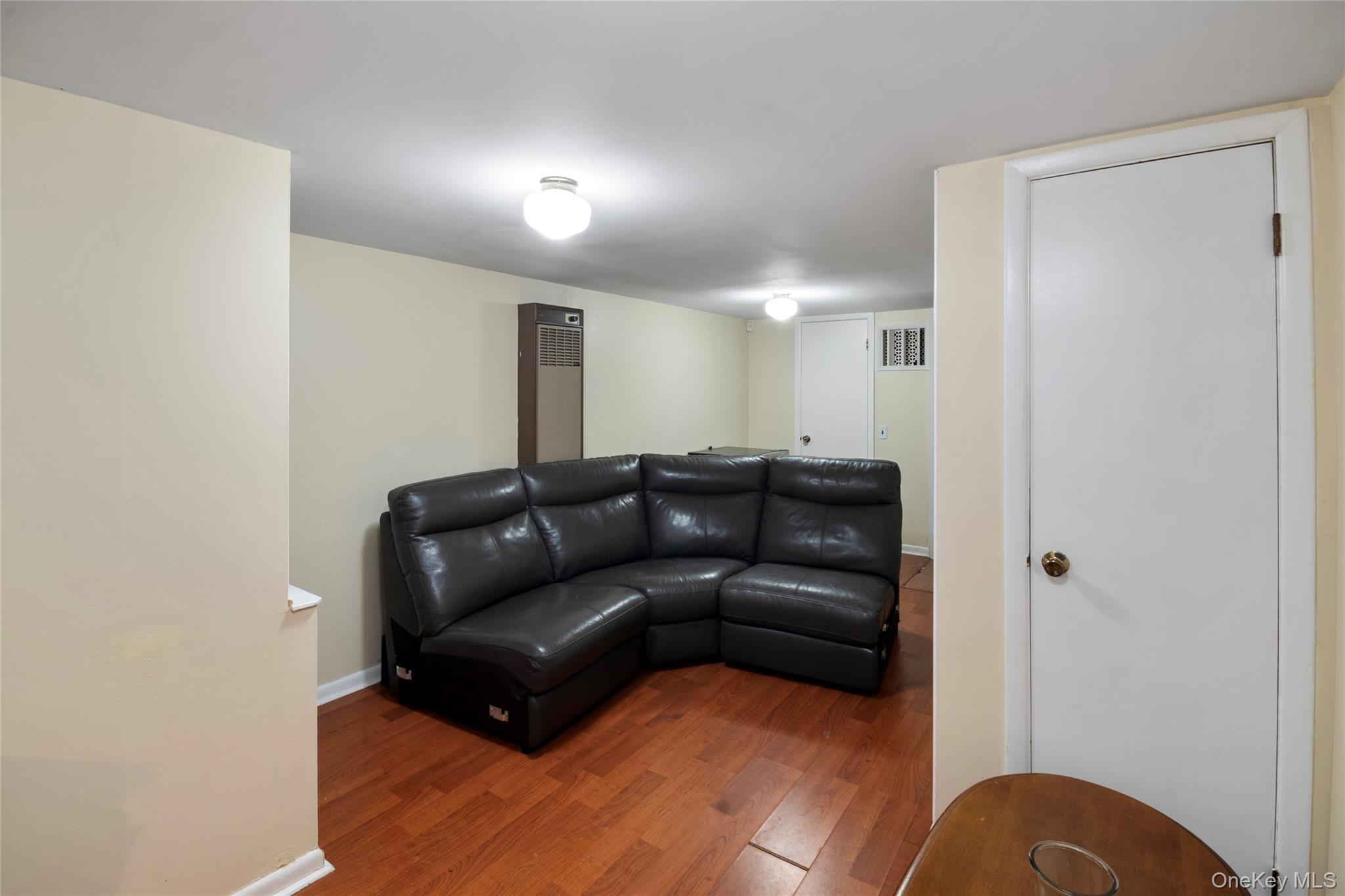277 Horseblock Road Farmingville, NY 11738 - Photo 19 of 28 Living room with wood finished floors and baseboards