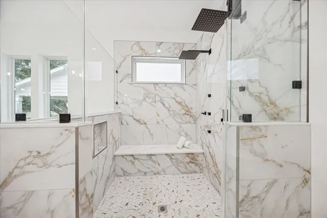a bathroom with bathtub shower and a sink