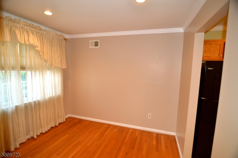 45 Crestview Lane Mount Arlington, NJ 07856 - Photo 8 of 11 a view of an empty room with wooden floor and a window