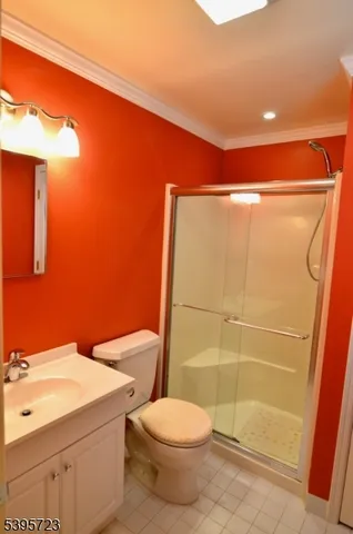 a bathroom with a toilet a sink and shower