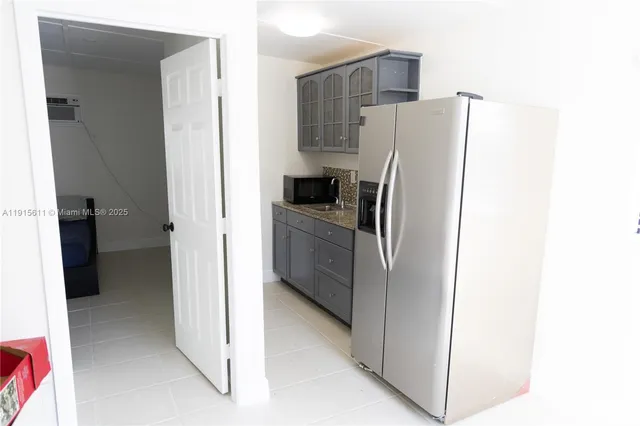 a view of a kitchen from a hallway