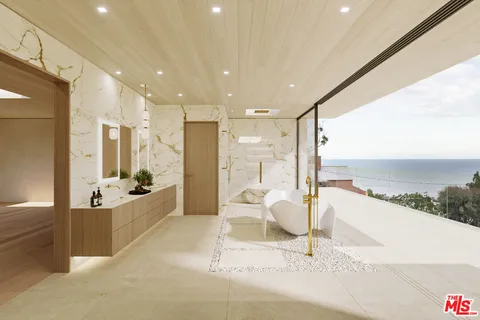 a large living room with stainless steel appliances kitchen island granite countertop furniture and a large window